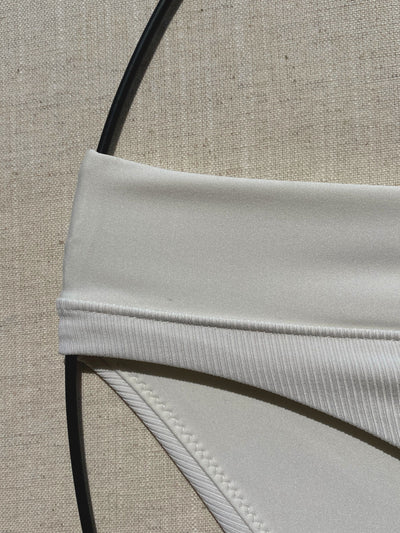 Bikini-bottom-classic-ivory-white-with-rib-fabric-and-embroidery-waistband-close-up