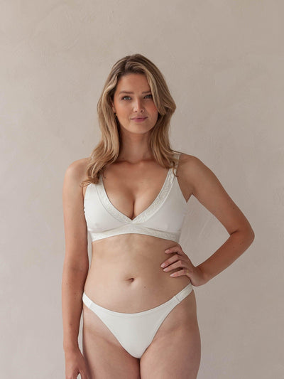 Bikini top Plunge V-neck and V-Shape bottom in white with rib fabric and embroidery, woman torso